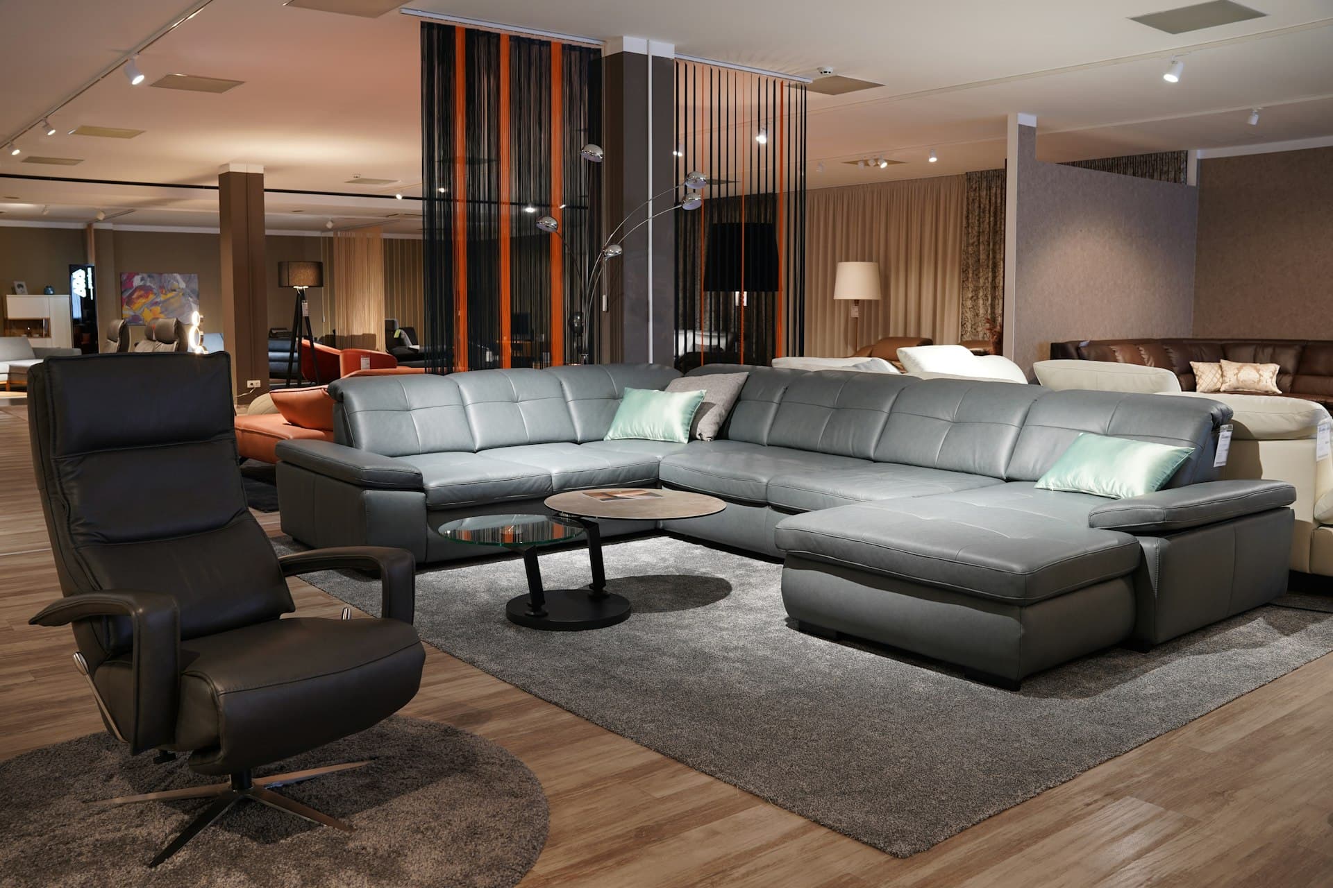 Luxury living room with warm wooden flooring and refined furnishings