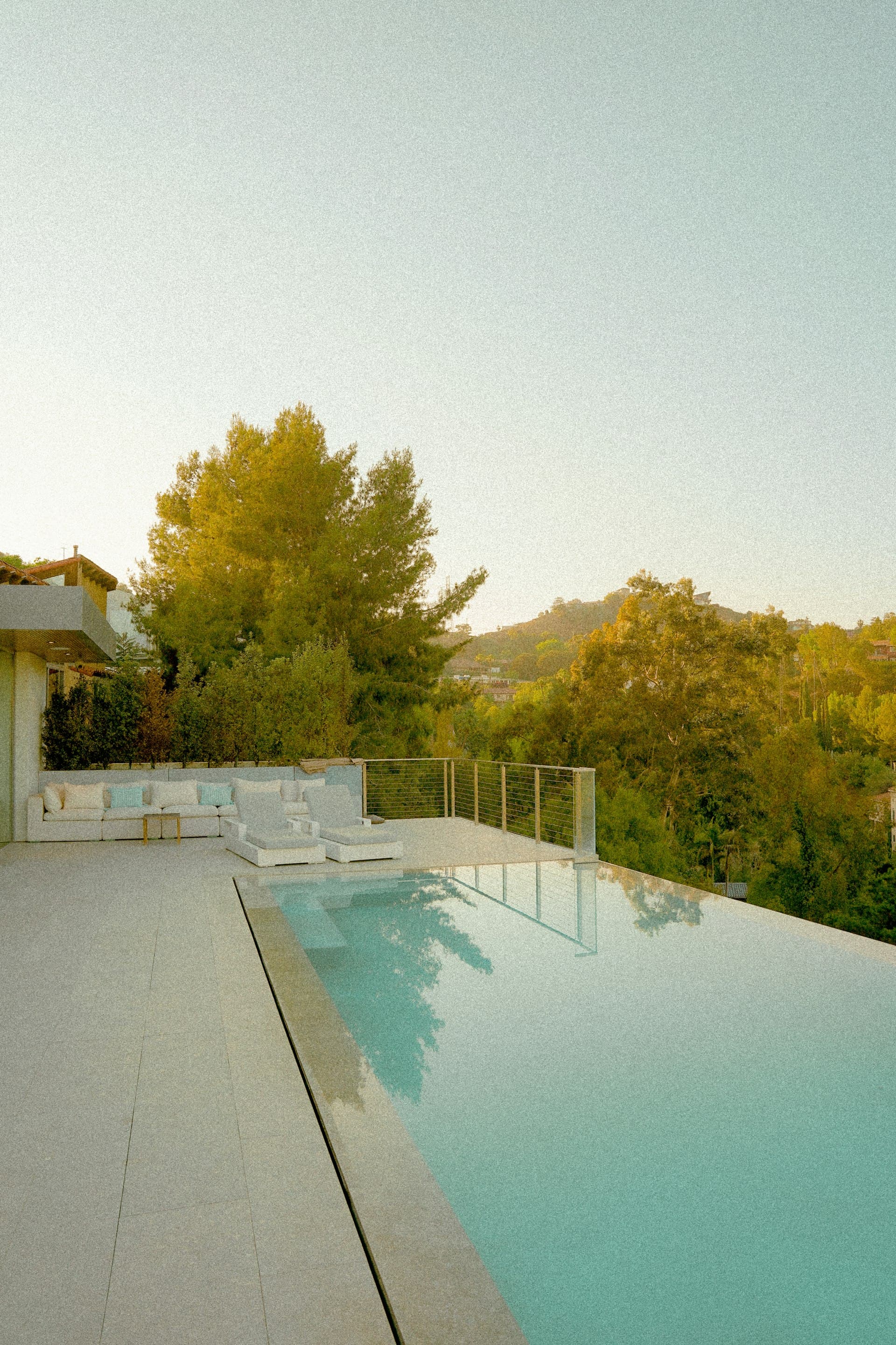 Luxury villa with swimming pool and landscape lighting at night